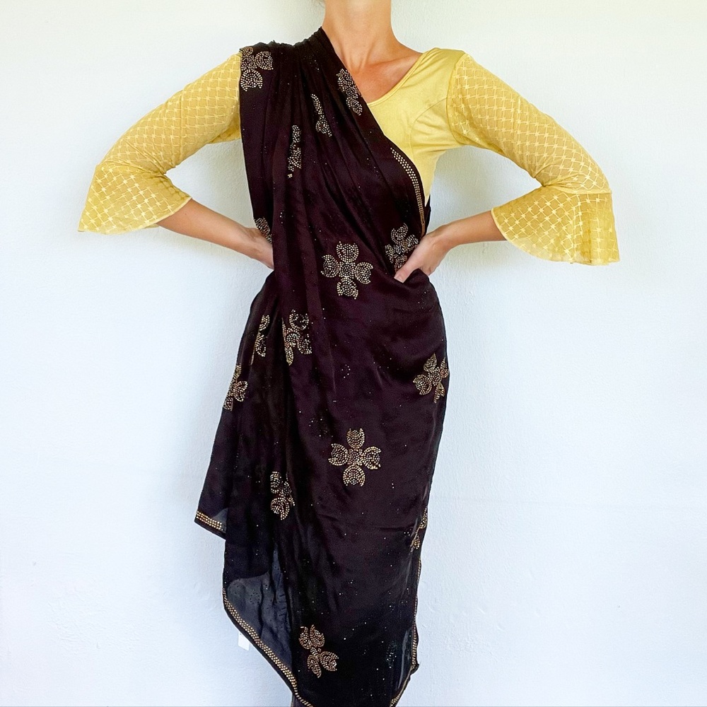 Traditional black and gold beaded sari and matching choli top